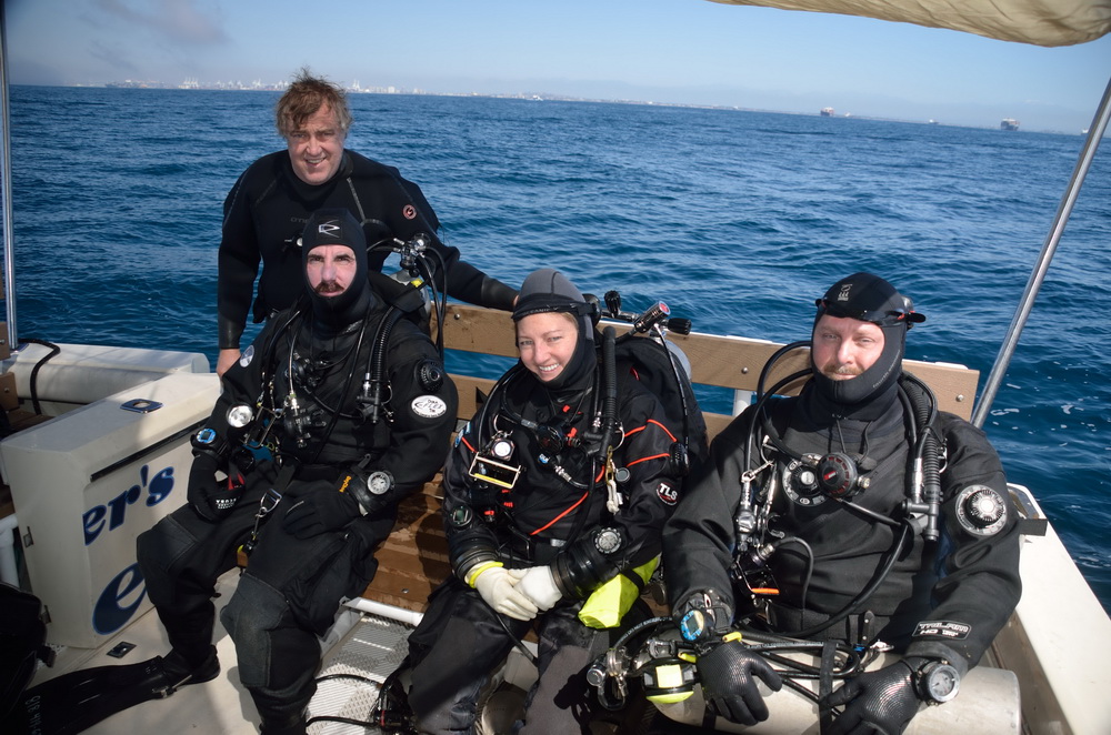 Kim with other divers ready to go retrieve manmade debris