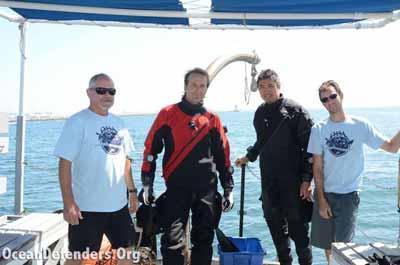 Some of ODA’s finest! John Krieger, Steve Millington, Andy The, and Graham Futerfas before the first dive. Notice the LA Harbor lighthouse in the background – that’s where we went to do our cleanup work.