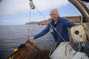 Ocean Defenders Alliance Founder Kurt Lieber hauling trap