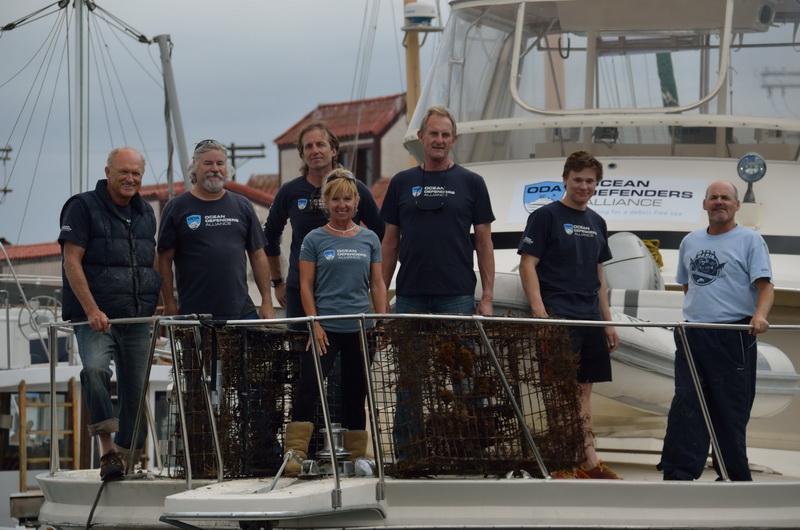 The ODA Dive & Boat Crew with the recovered lobster traps on bow.