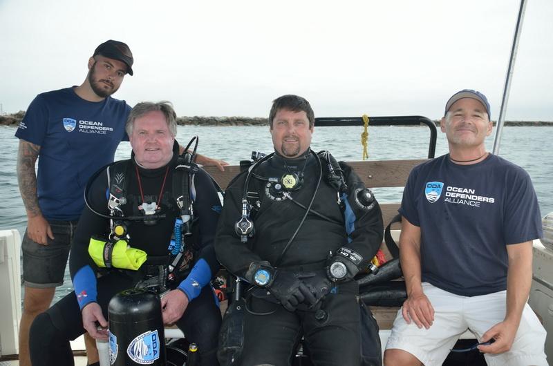 ODA Boat Crew Adam Fram and Rex Levi with dive-gear-outfitted Al Laubenstein & Jeff Larsen