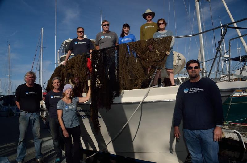 Dispaying the ghost nets, the crew at days end.