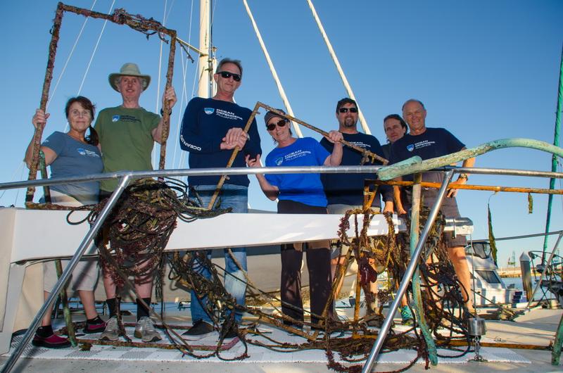 Ocean Defenders Dive and Boat Crew happily display recovered lobster trap lines and remnants