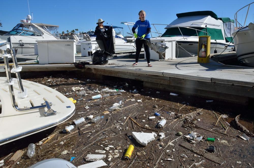 ODA Volunteers Lisa and Jillian cleanup harbor debris