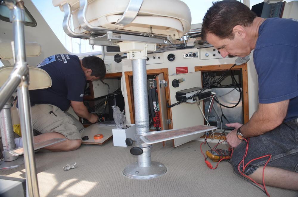 Jeff and Kevin Augarten - jacks of all trades! Working on the boat's electronics.