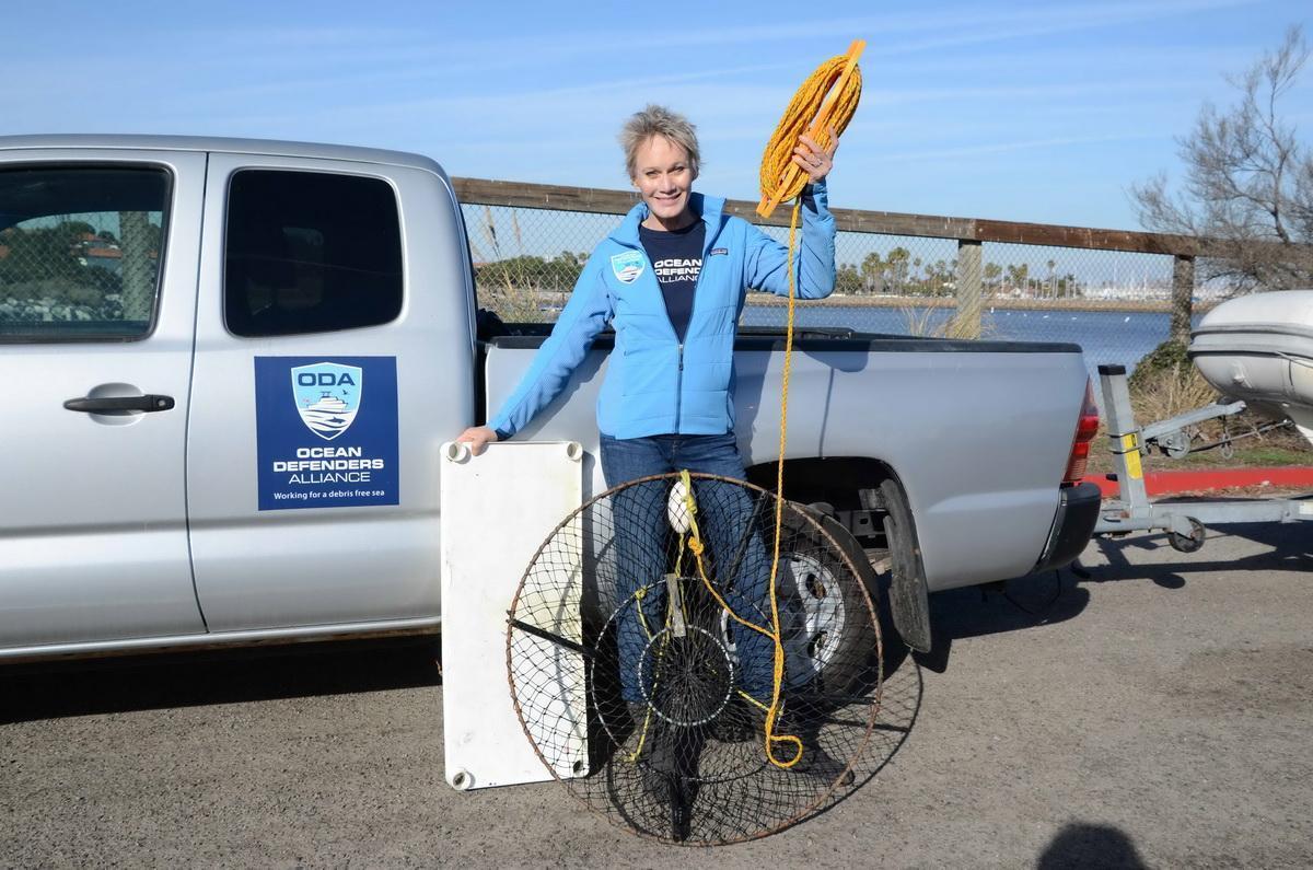 ODA volunteer Linda and hoop trap removed from ocean