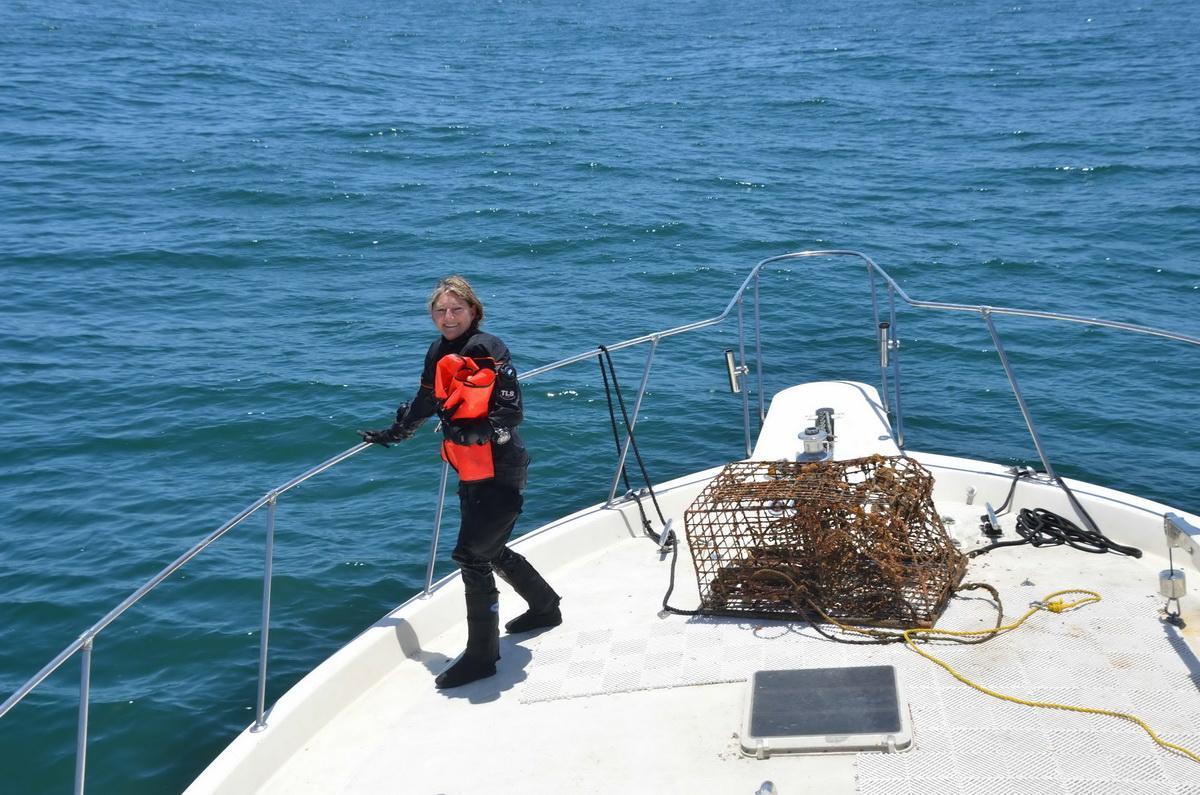 SCUBA diver Kim Cardenas with lobster trap