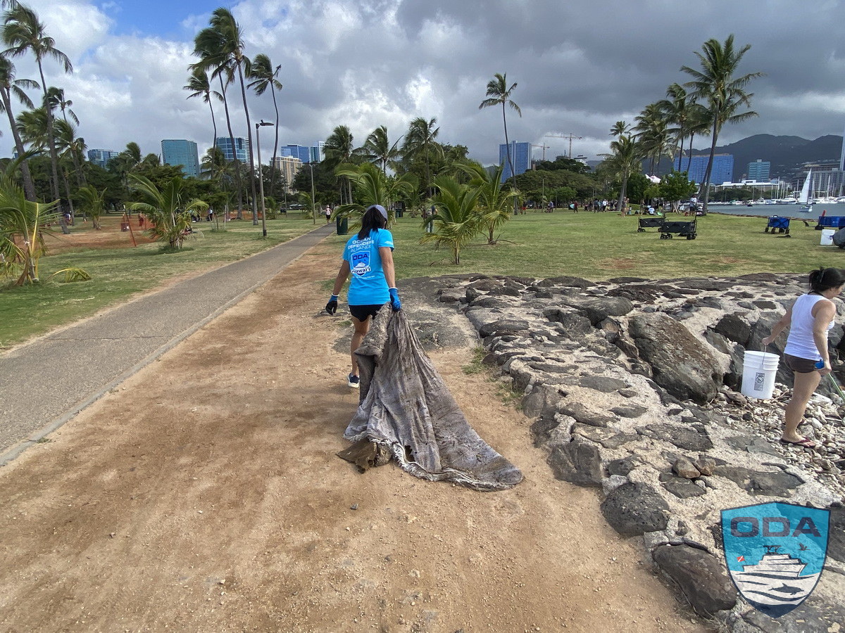 ODA volunteers properly dispose of marine debris.