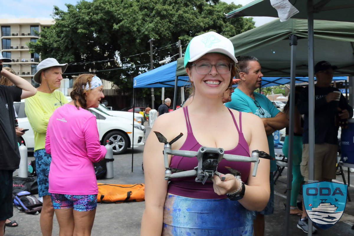 Volunteer poses with recovered drone
